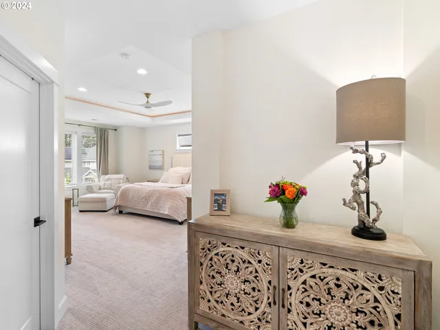 a bedroom with furniture and a lamp