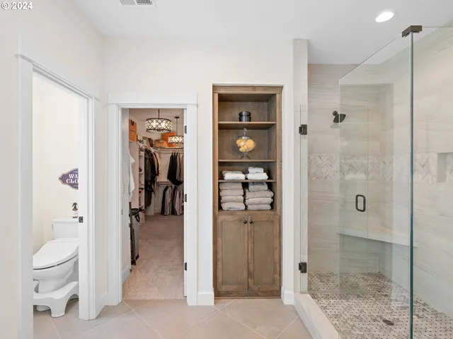 a bathroom with a shower and a sink