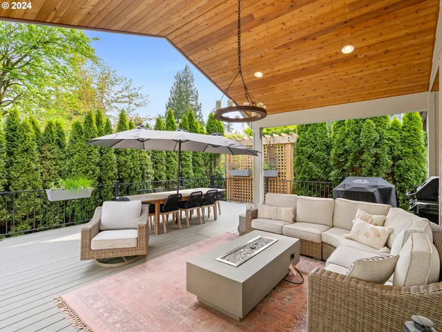 a balcony with furniture and a garden