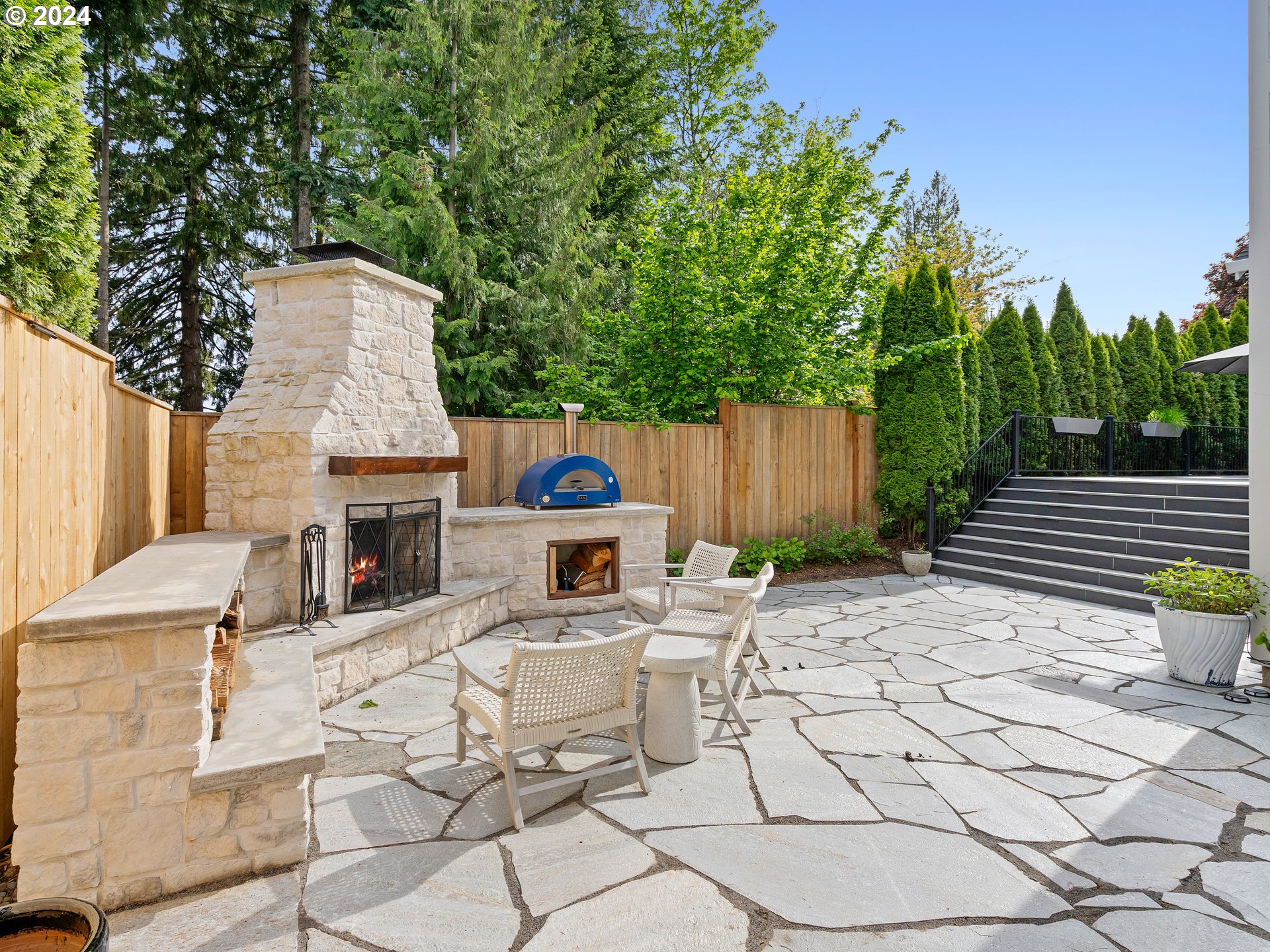 9010 Southwest Inez Street Tigard, OR 97224 - Photo 36 of 42 a view of a patio with table and chairs and potted plants