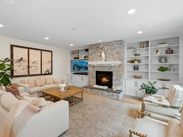 a living room with furniture and a fireplace