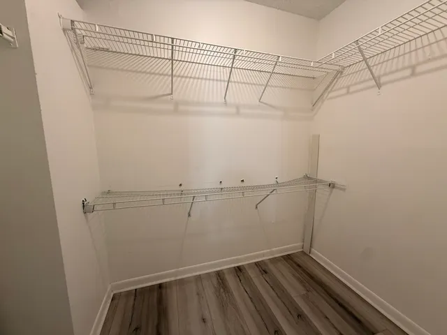 a view of a room with racks on the wall