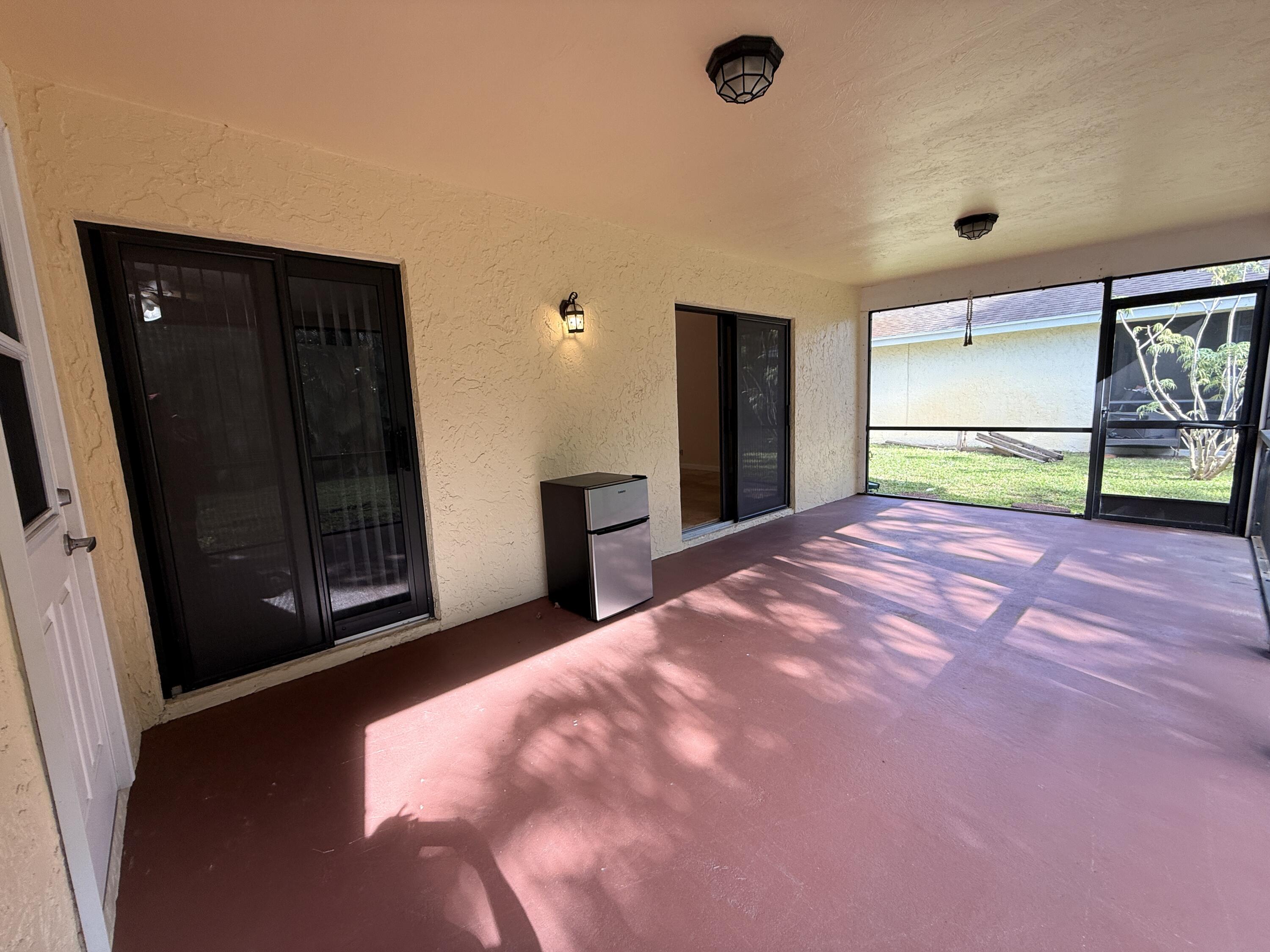 450 Northeast 42nd Street Boca Raton, FL 33431 - Photo 19 of 25 Screened Covered Concrete Porch