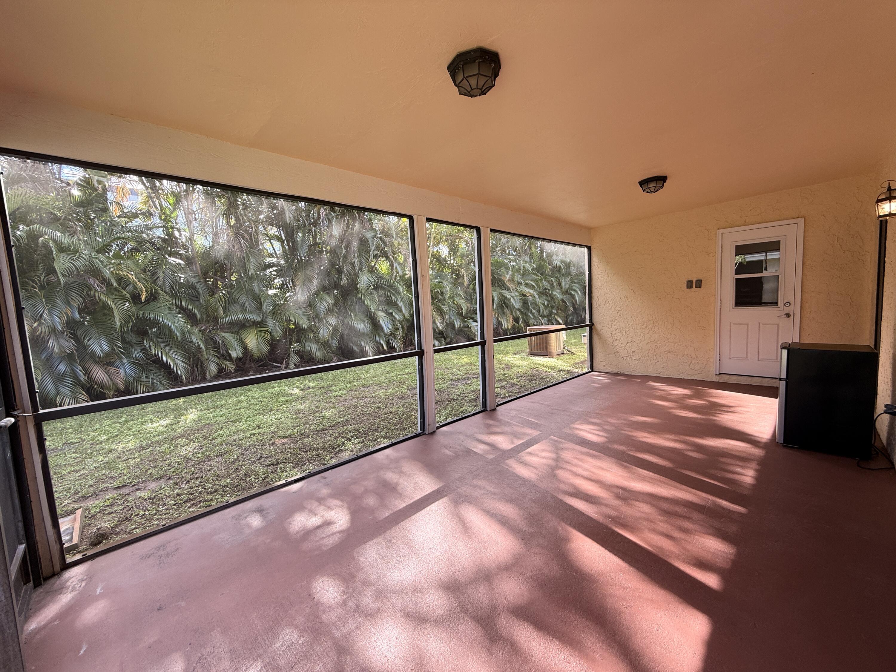 450 Northeast 42nd Street Boca Raton, FL 33431 - Photo 21 of 25 Screened Covered Porch Laundry Rm