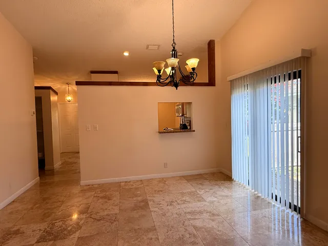 a view of a room with a chandelier