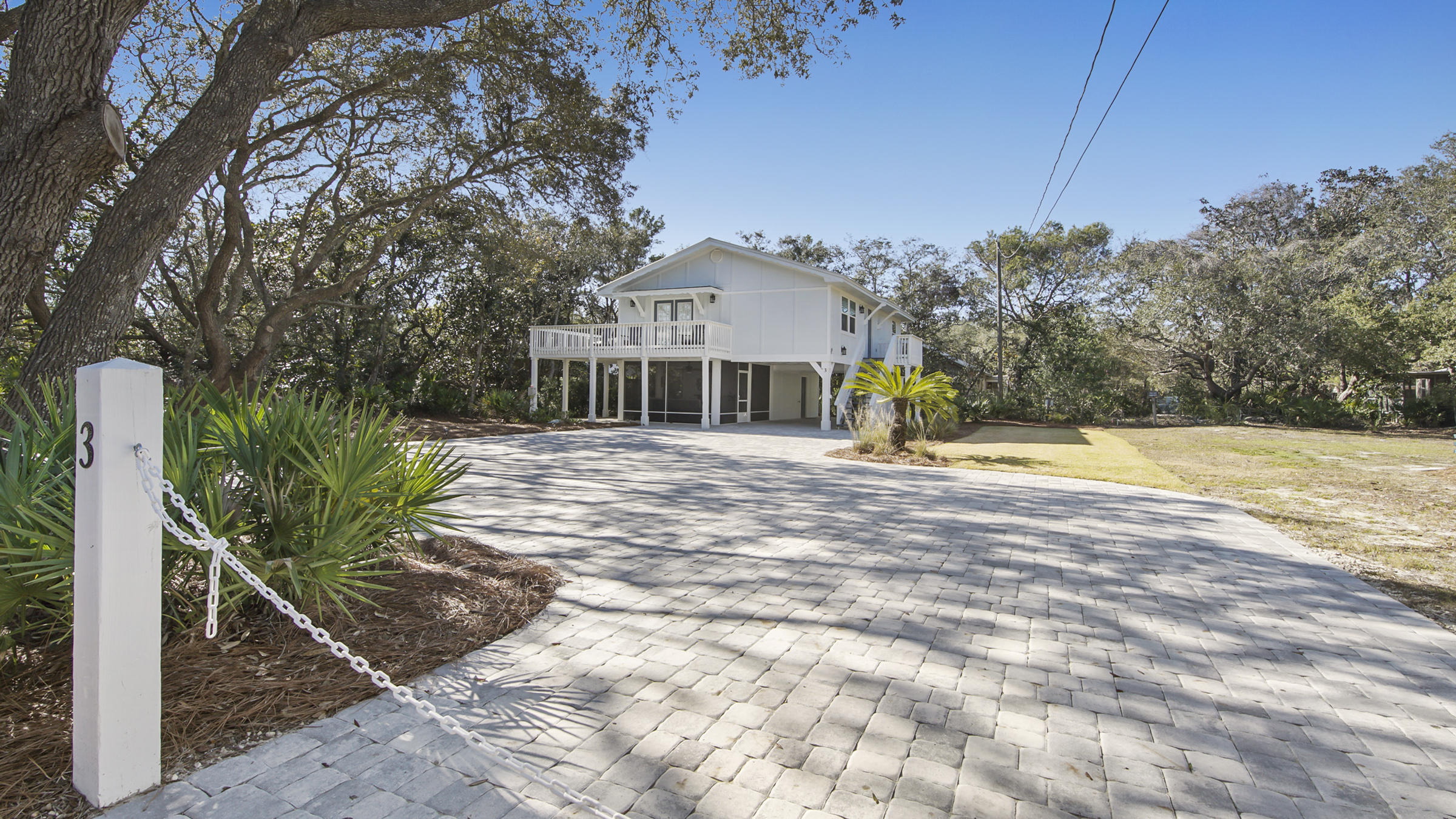 a view of a house with basketball court