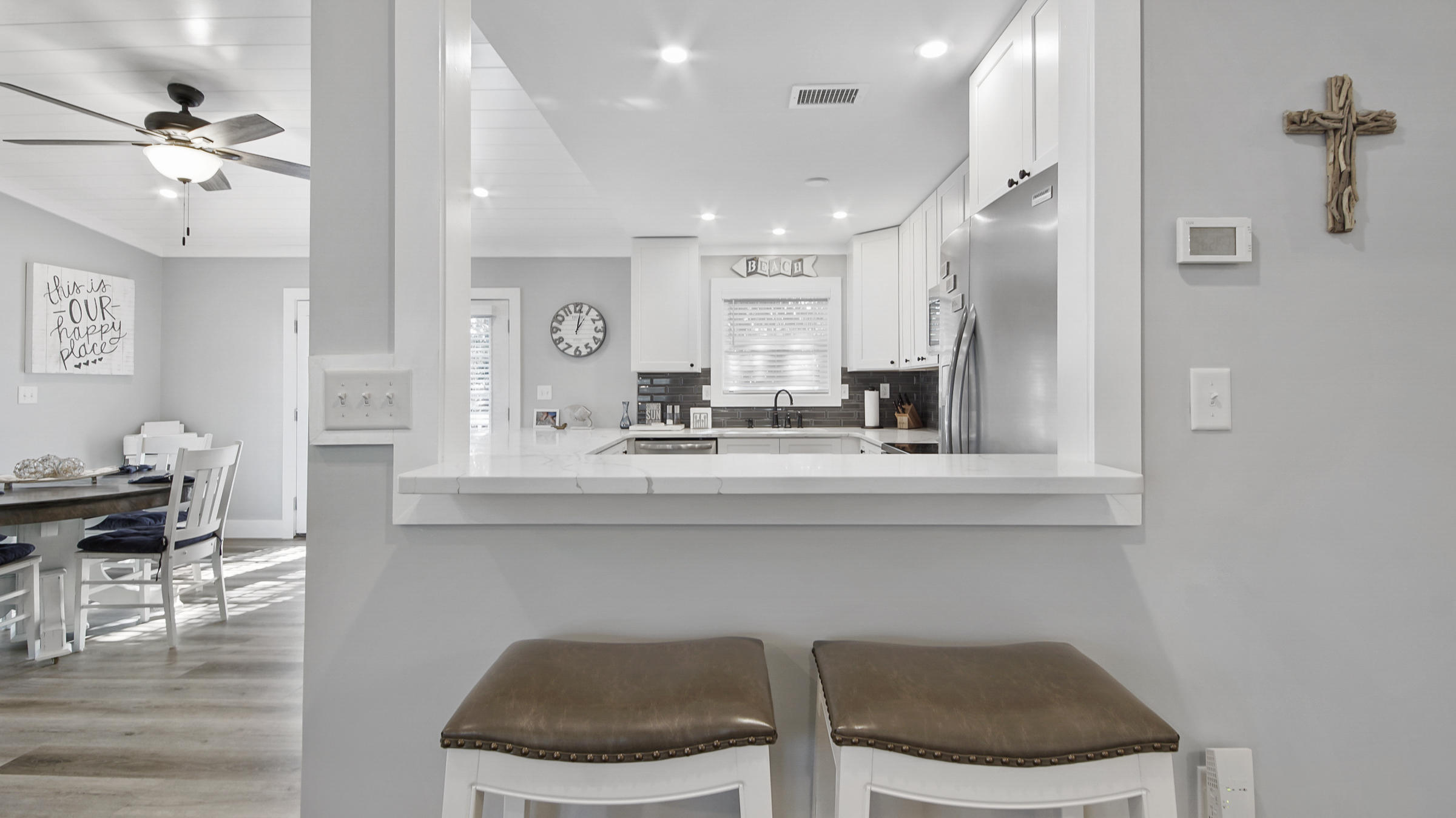 3 Dalton Drive Santa Rosa Beach, FL 32459 - Photo 12 of 33 a kitchen with a dining table chairs cabinets and stainless steel appliances