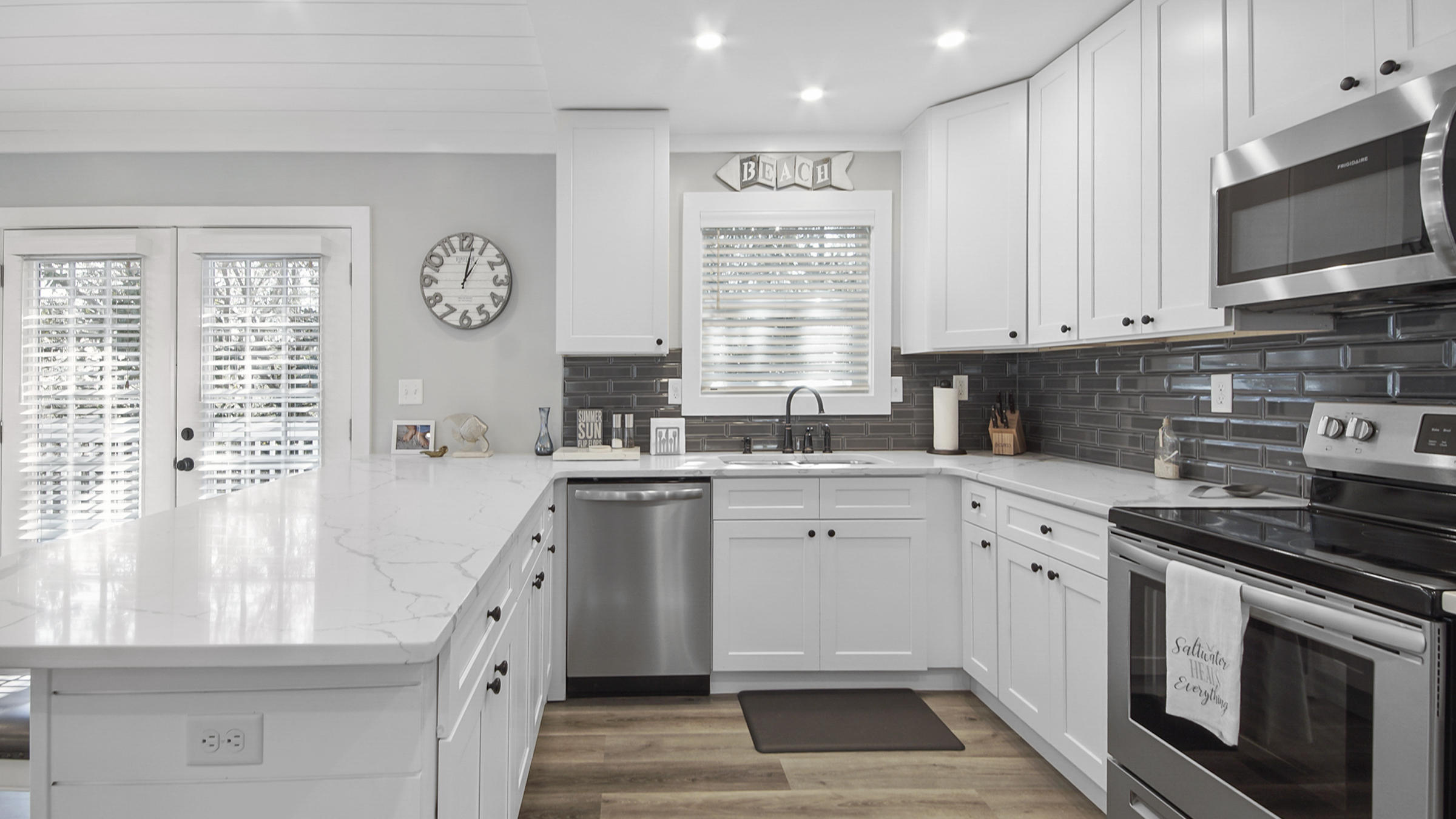 3 Dalton Drive Santa Rosa Beach, FL 32459 - Photo 14 of 33 a kitchen with stainless steel appliances granite countertop a stove a sink and a microwave