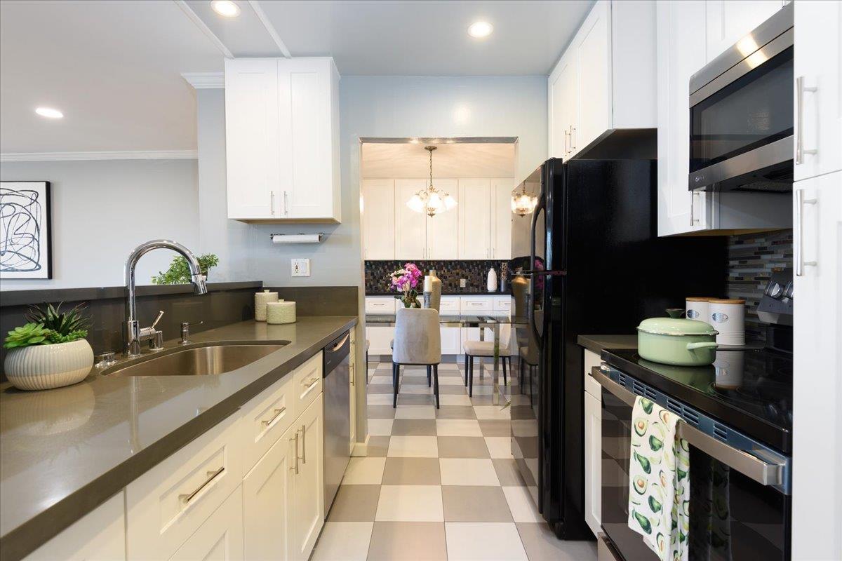 222 Laurel Street, Unit 101 San Carlos, CA 94070 - Photo 16 of 36 a kitchen with a sink dishwasher a stove and a refrigerator with wooden floor