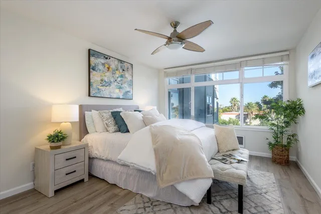 a bed room with a bed and a window