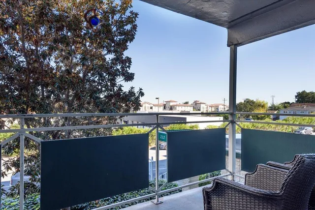 a view of balcony with chairs