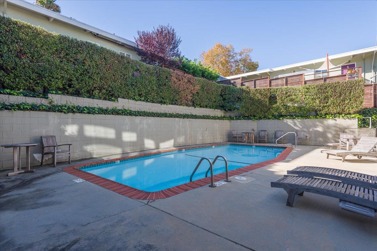 222 Laurel Street, Unit 101 San Carlos, CA 94070 - Photo 27 of 36 a view of a swimming pool with a lounge chair