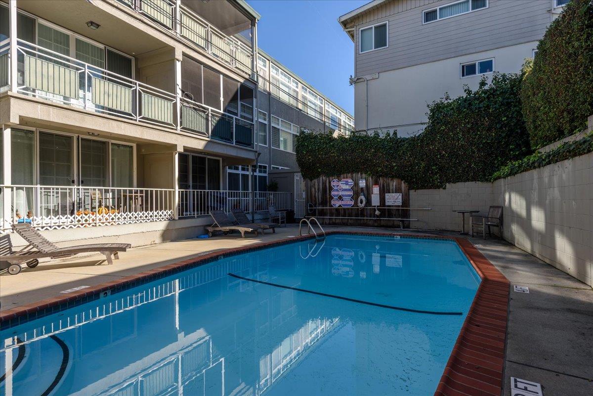 222 Laurel Street, Unit 101 San Carlos, CA 94070 - Photo 28 of 36 a view of a swimming pool with a lounge chairs