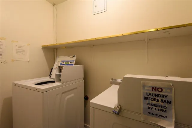a close up of a storage and utility room with washer and dryer