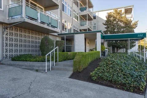 a view of a building with a yard