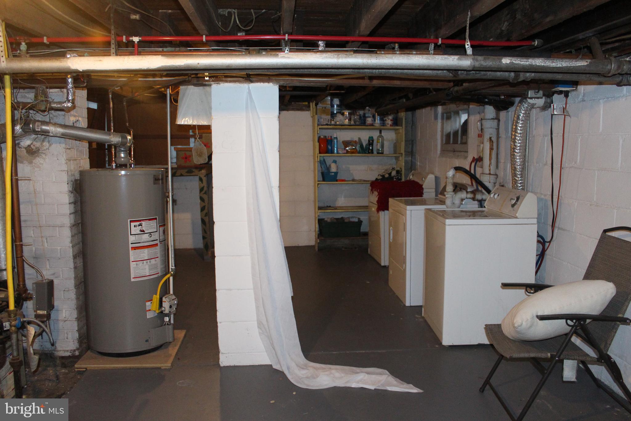 319 Swarthmore Road Glassboro, NJ 08028 - Photo 14 of 16 a view of a storage room with washer and dryer