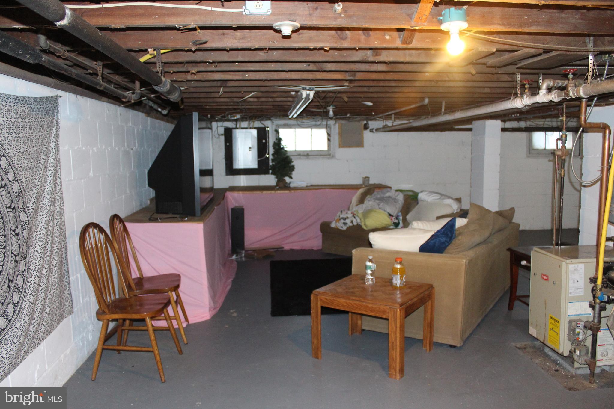 319 Swarthmore Road Glassboro, NJ 08028 - Photo 16 of 16 a patio with a table and chairs