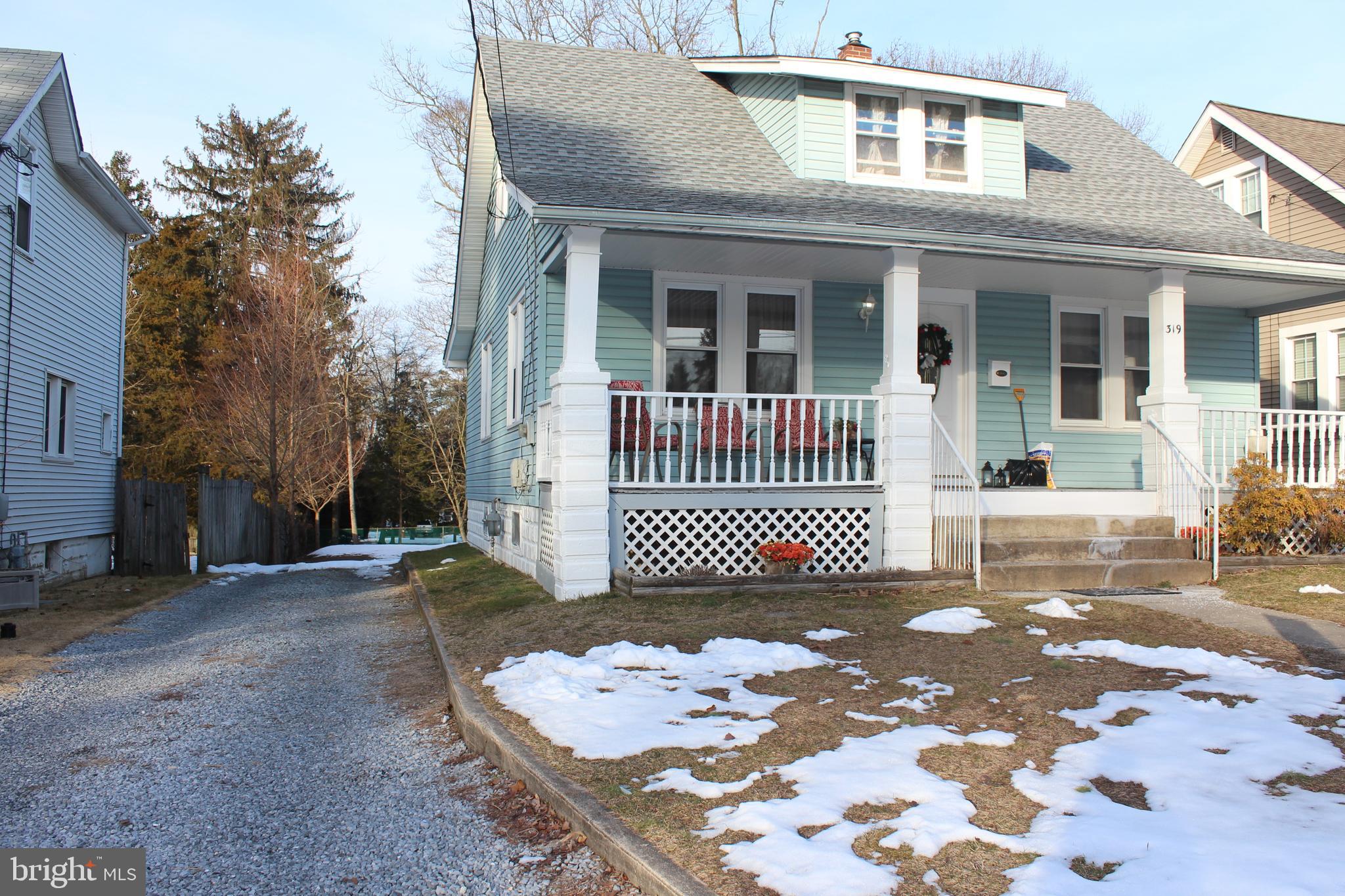 319 Swarthmore Road Glassboro, NJ 08028 - Photo 2 of 16 a front view of a house with a garden