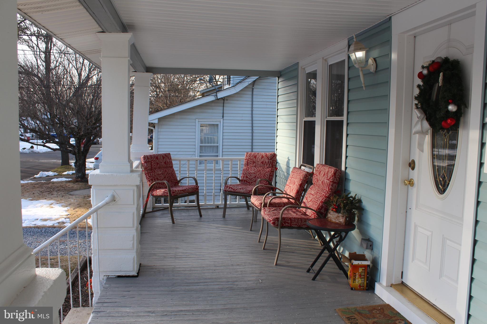 319 Swarthmore Road Glassboro, NJ 08028 - Photo 4 of 16 a backyard of a house with table and chairs