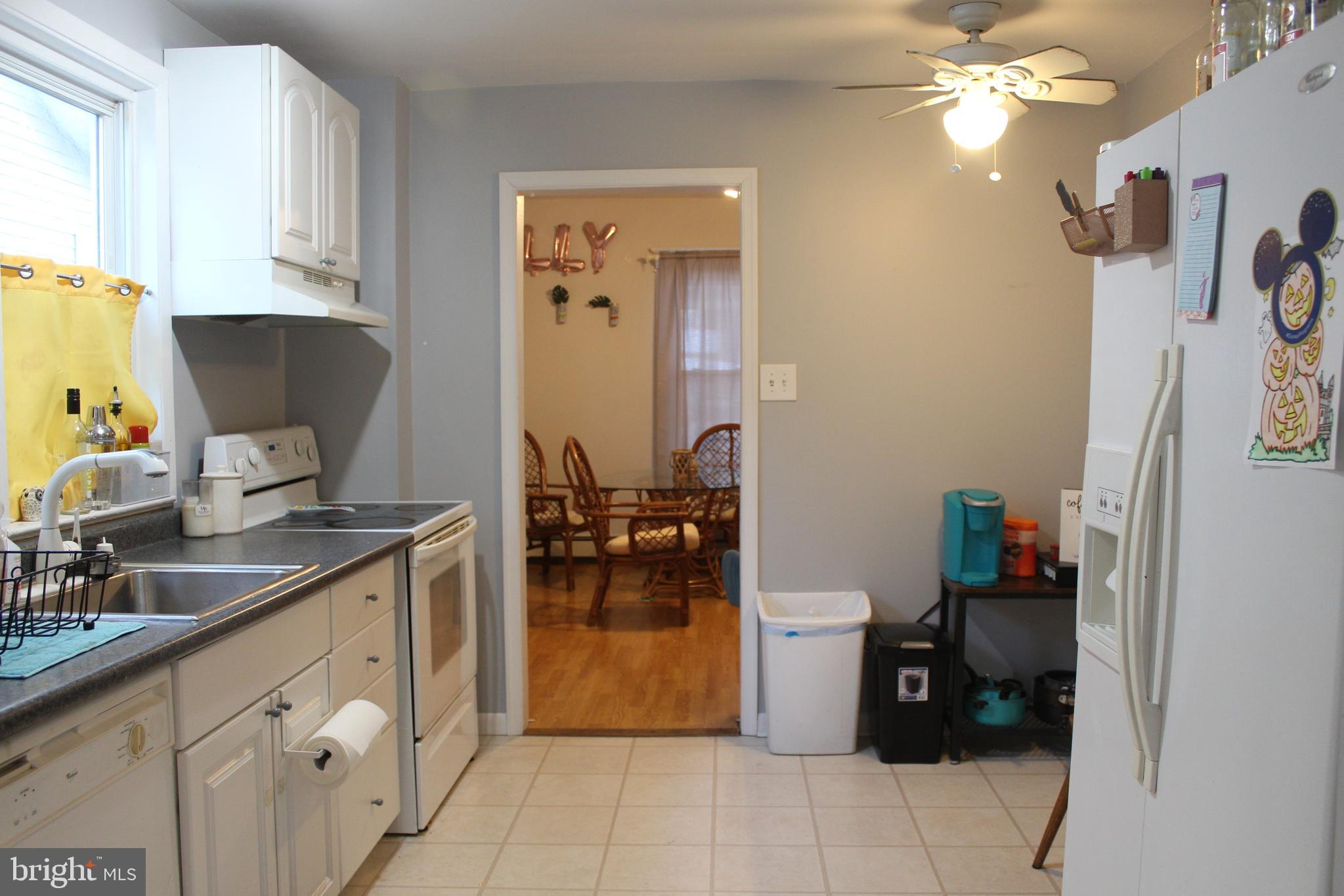 319 Swarthmore Road Glassboro, NJ 08028 - Photo 8 of 16 a kitchen with a sink and a stove top oven