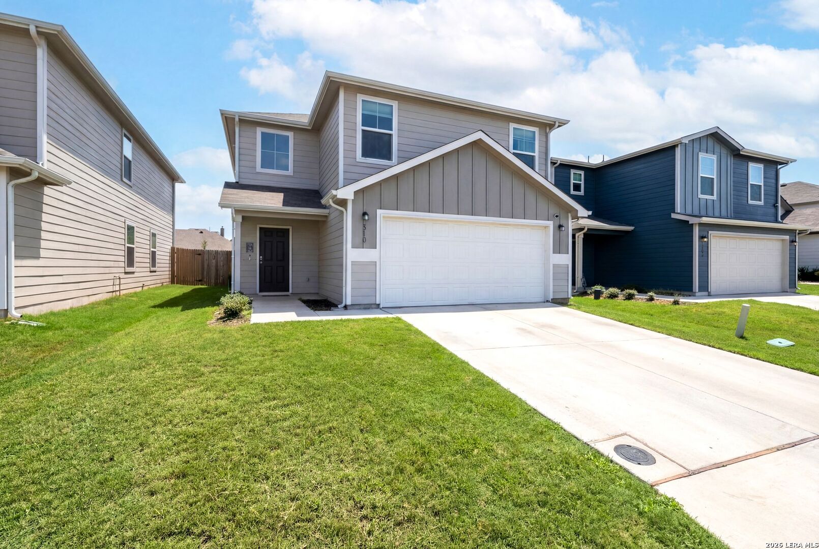 6710 Turnpike Converse, TX 78109 - Photo 2 of 34 a front view of a house with a yard and garage