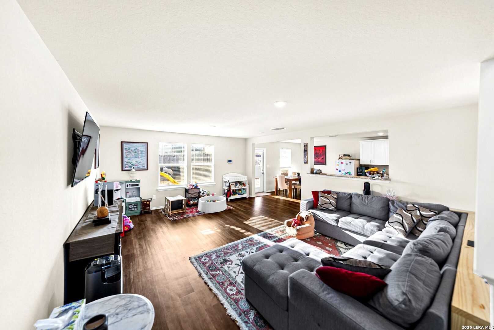 6710 Turnpike Converse, TX 78109 - Photo 31 of 34 a living room with furniture fireplace and a flat screen tv