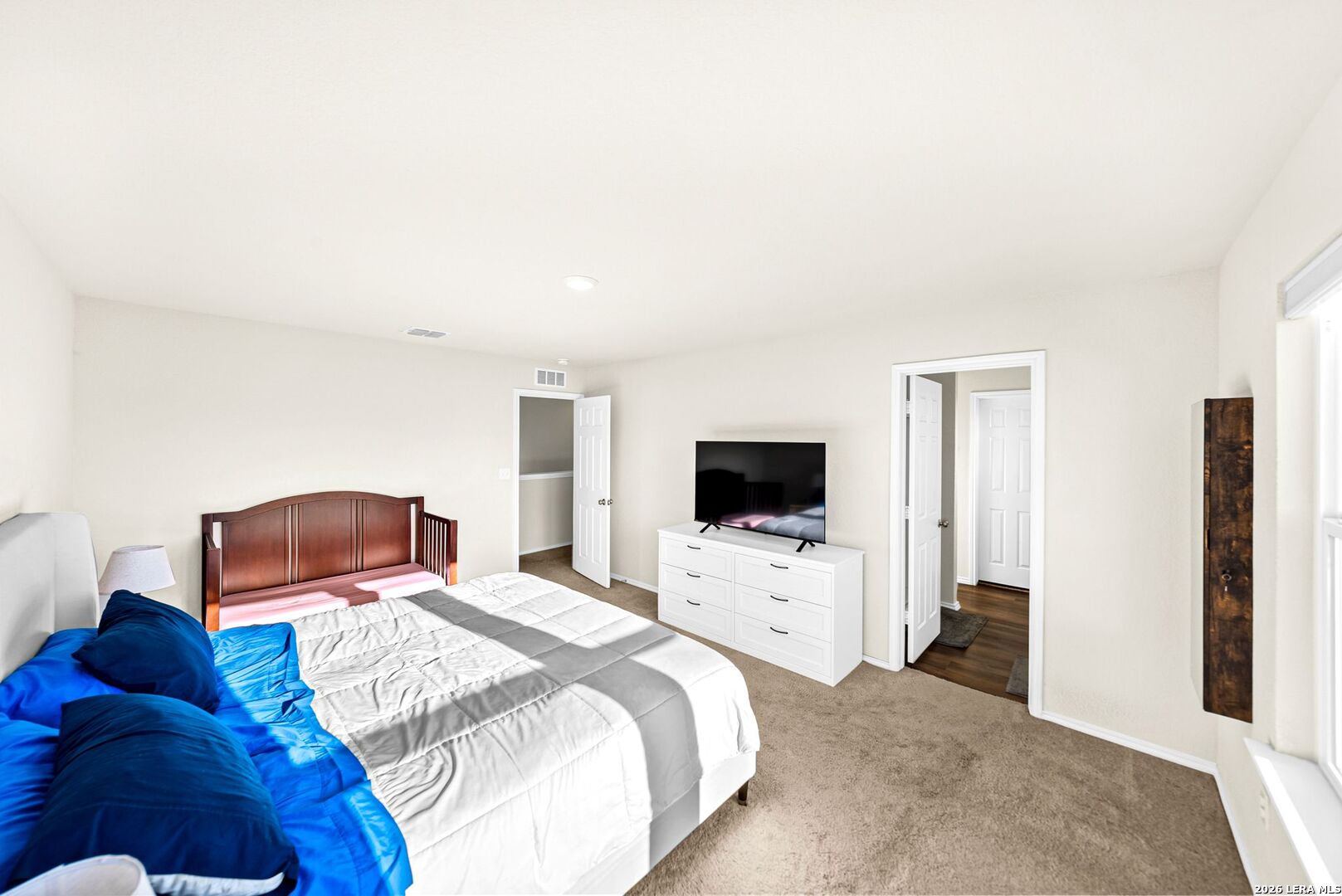 6710 Turnpike Converse, TX 78109 - Photo 33 of 34 a bedroom with a bed and a flat screen tv