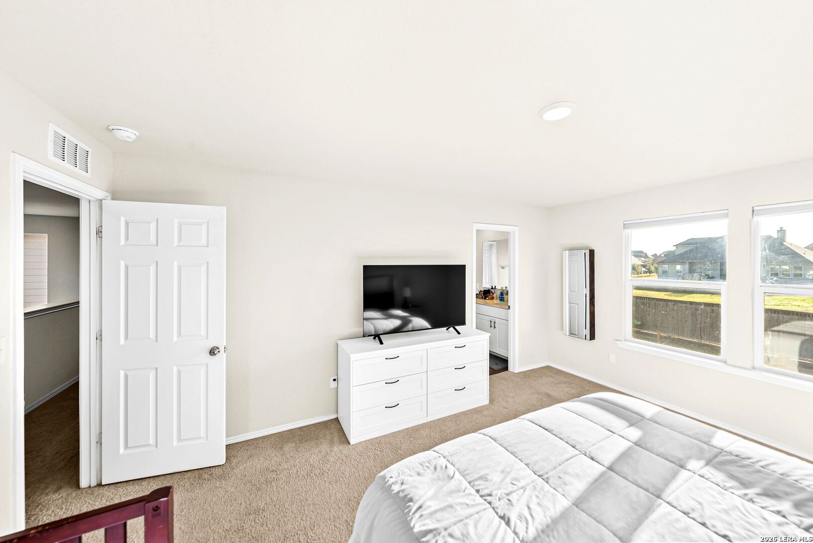 6710 Turnpike Converse, TX 78109 - Photo 34 of 34 a bedroom with a bed and a flat screen tv