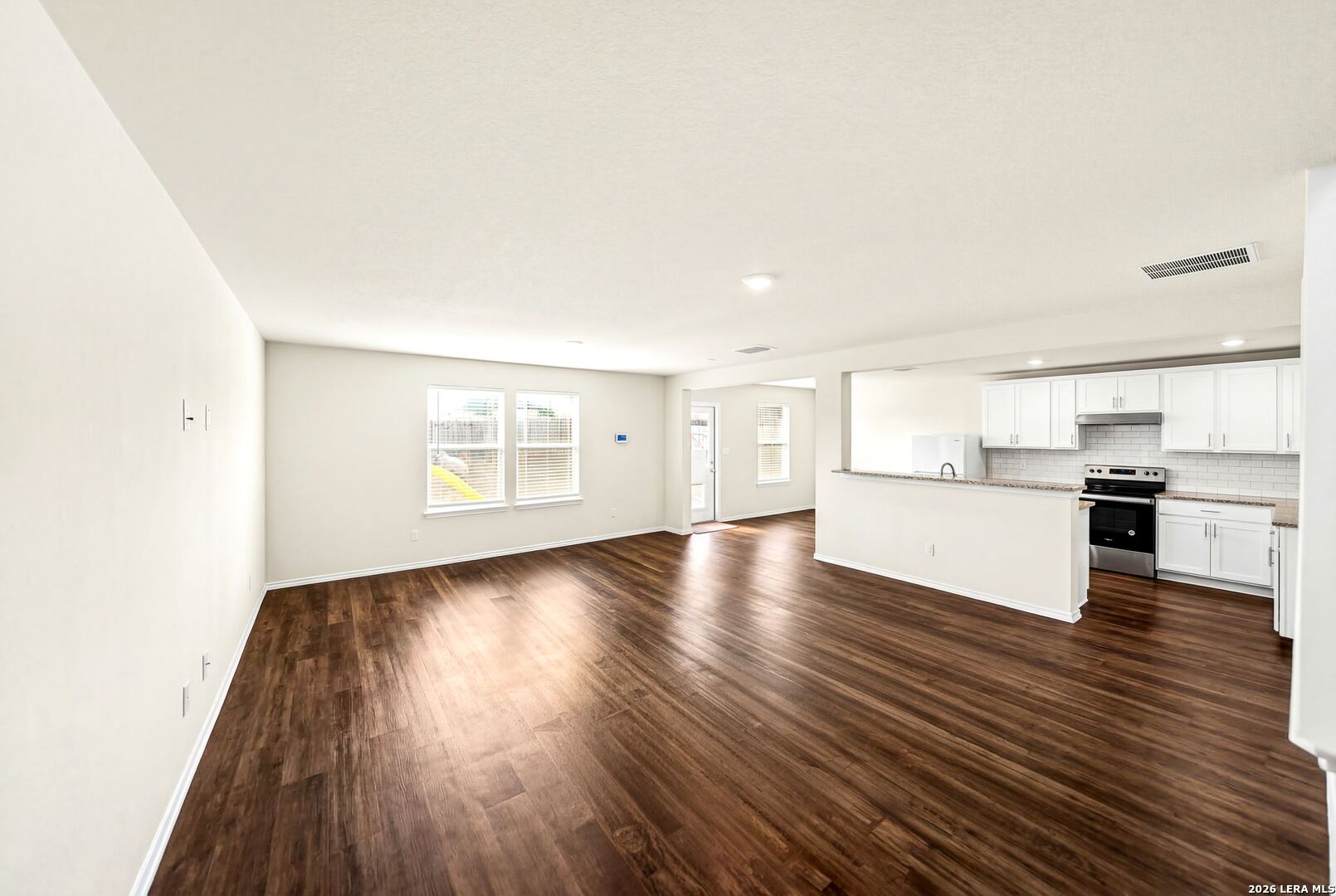 6710 Turnpike Converse, TX 78109 - Photo 5 of 34 a view of a kitchen with wooden floor and a kitchen