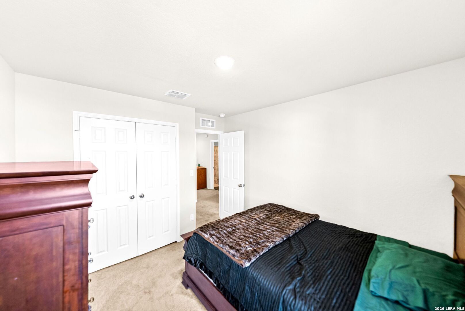 6710 Turnpike Converse, TX 78109 - Photo 6 of 34 a bedroom with a bed and a window