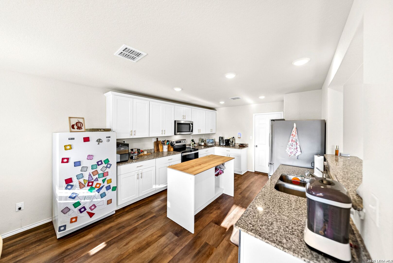 6710 Turnpike Converse, TX 78109 - Photo 9 of 34 a large white kitchen with lots of counter top space
