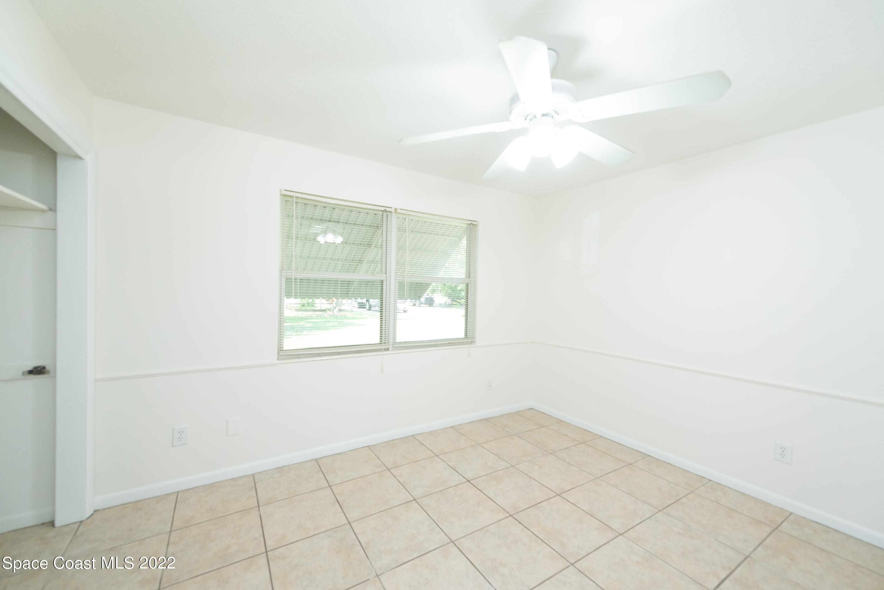2085 Harlock Road Melbourne, FL 32934 - Photo 11 of 27 a view of an empty room with a window
