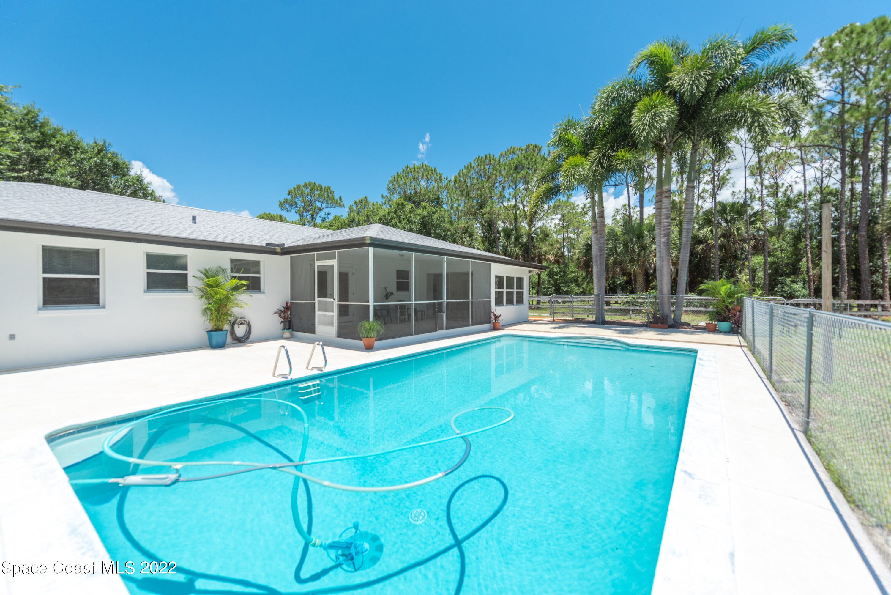 2085 Harlock Road Melbourne, FL 32934 - Photo 16 of 27 a view of a house with swimming pool and a porch