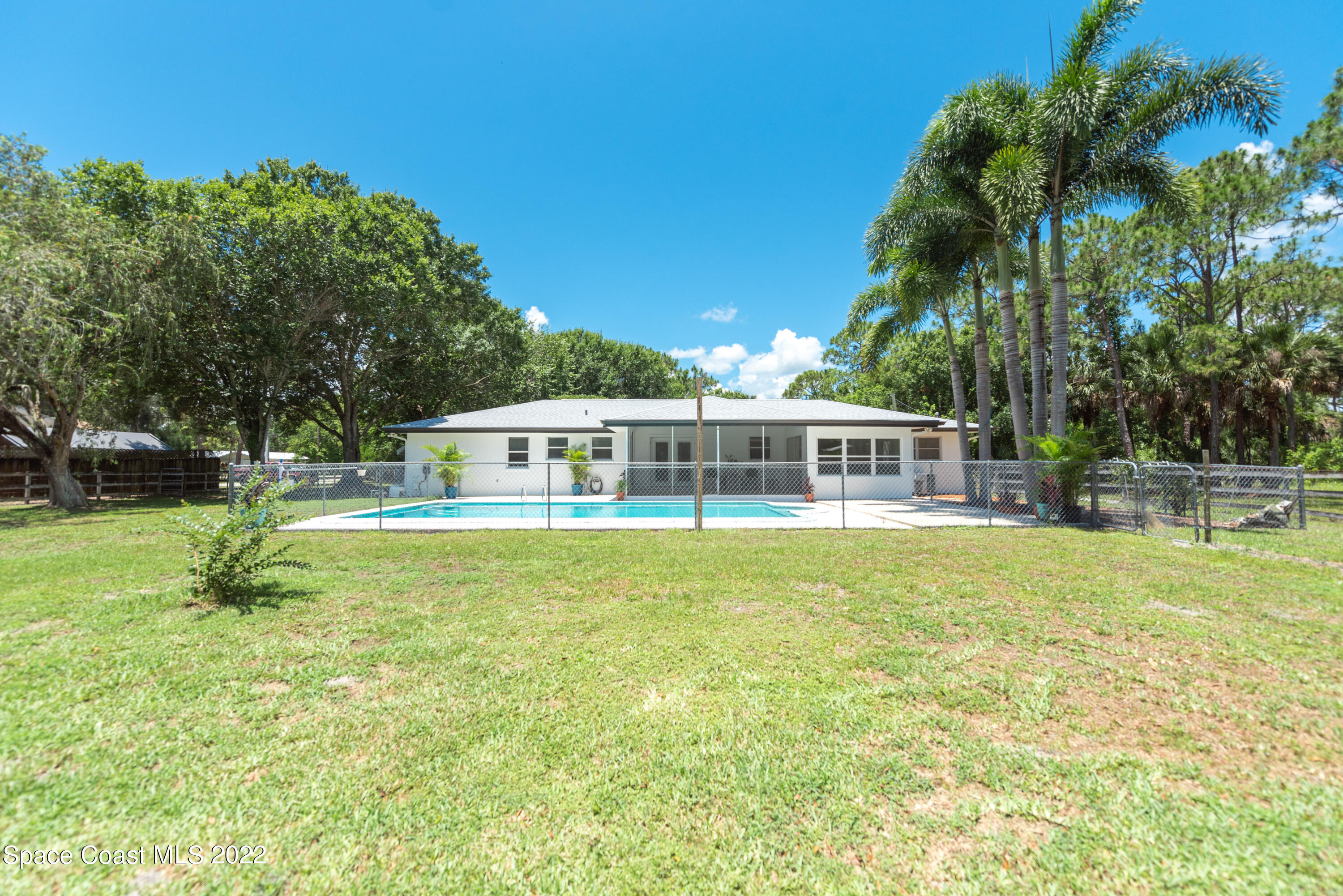 2085 Harlock Road Melbourne, FL 32934 - Photo 19 of 27 a front view of a house with a garden