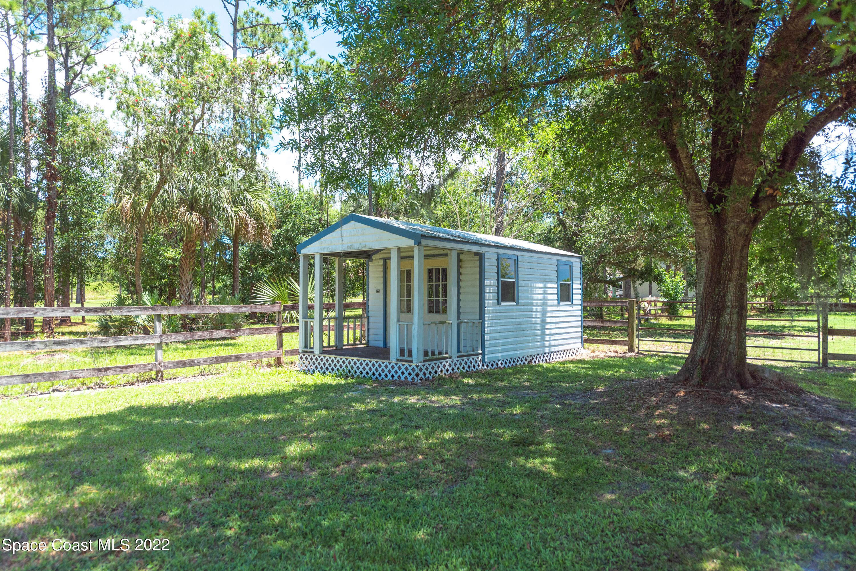 2085 Harlock Road Melbourne, FL 32934 - Photo 20 of 27 a view of a house with a yard