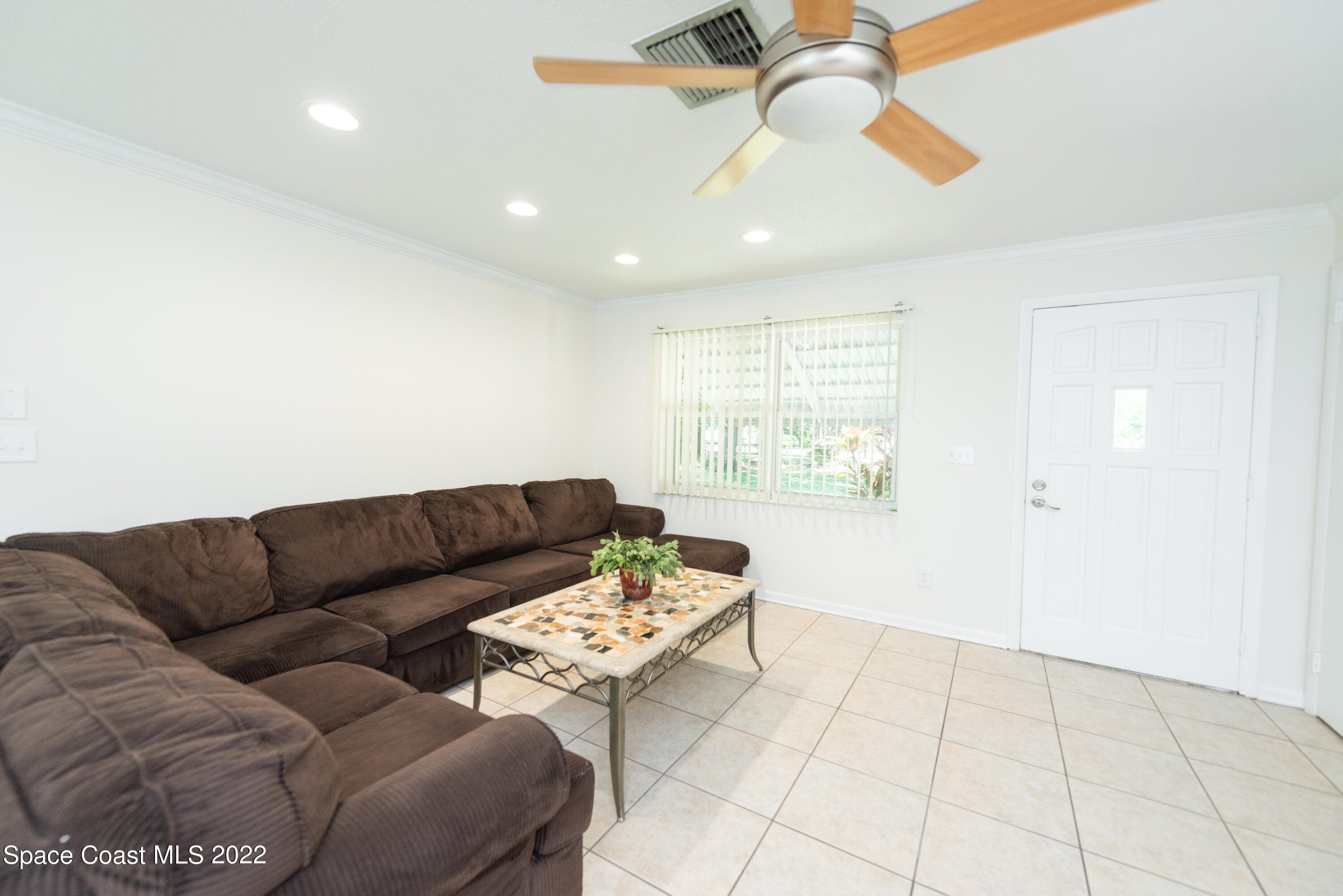 2085 Harlock Road Melbourne, FL 32934 - Photo 2 of 27 a living room with furniture and a window