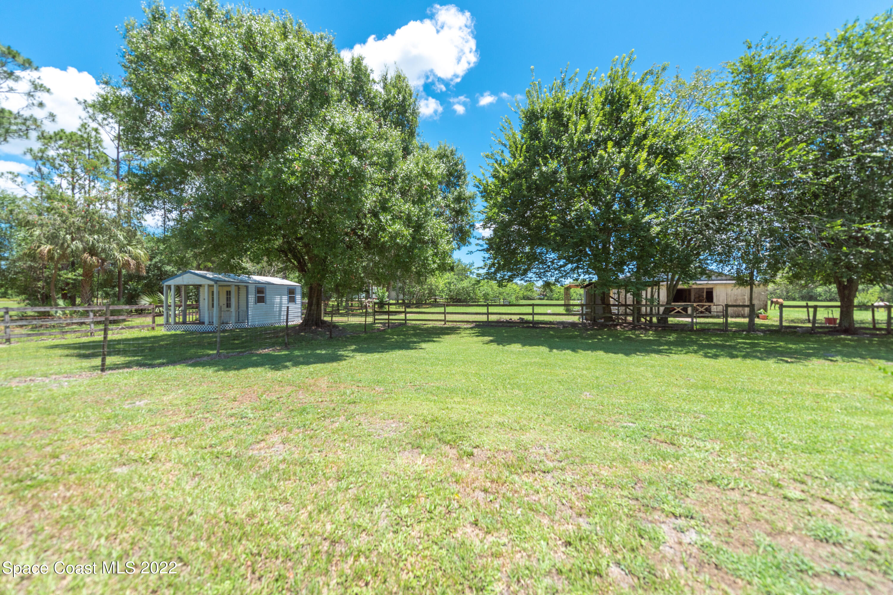 2085 Harlock Road Melbourne, FL 32934 - Photo 21 of 27 a front view of a house with a yard