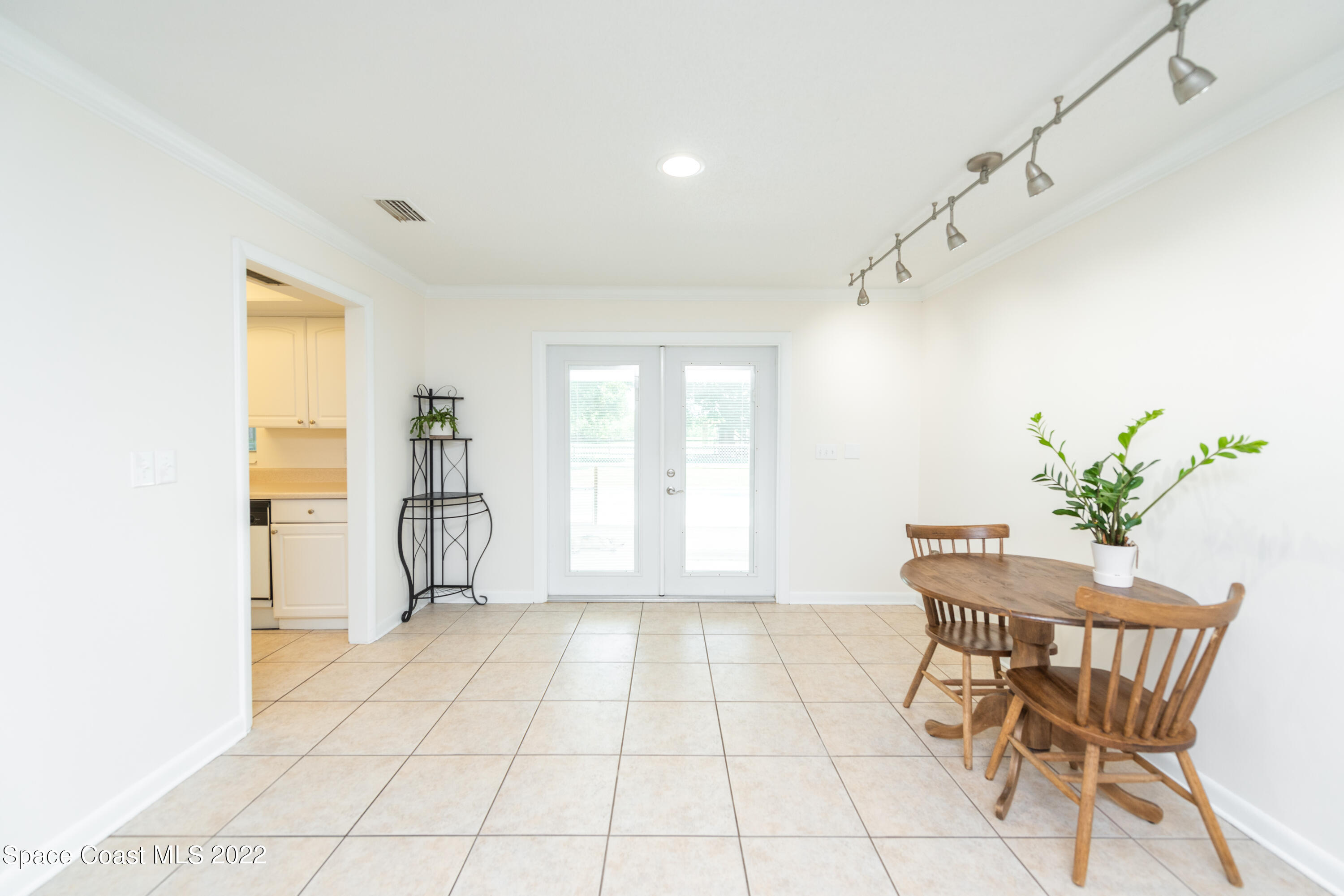 2085 Harlock Road Melbourne, FL 32934 - Photo 4 of 27 a view of a room with furniture and a window