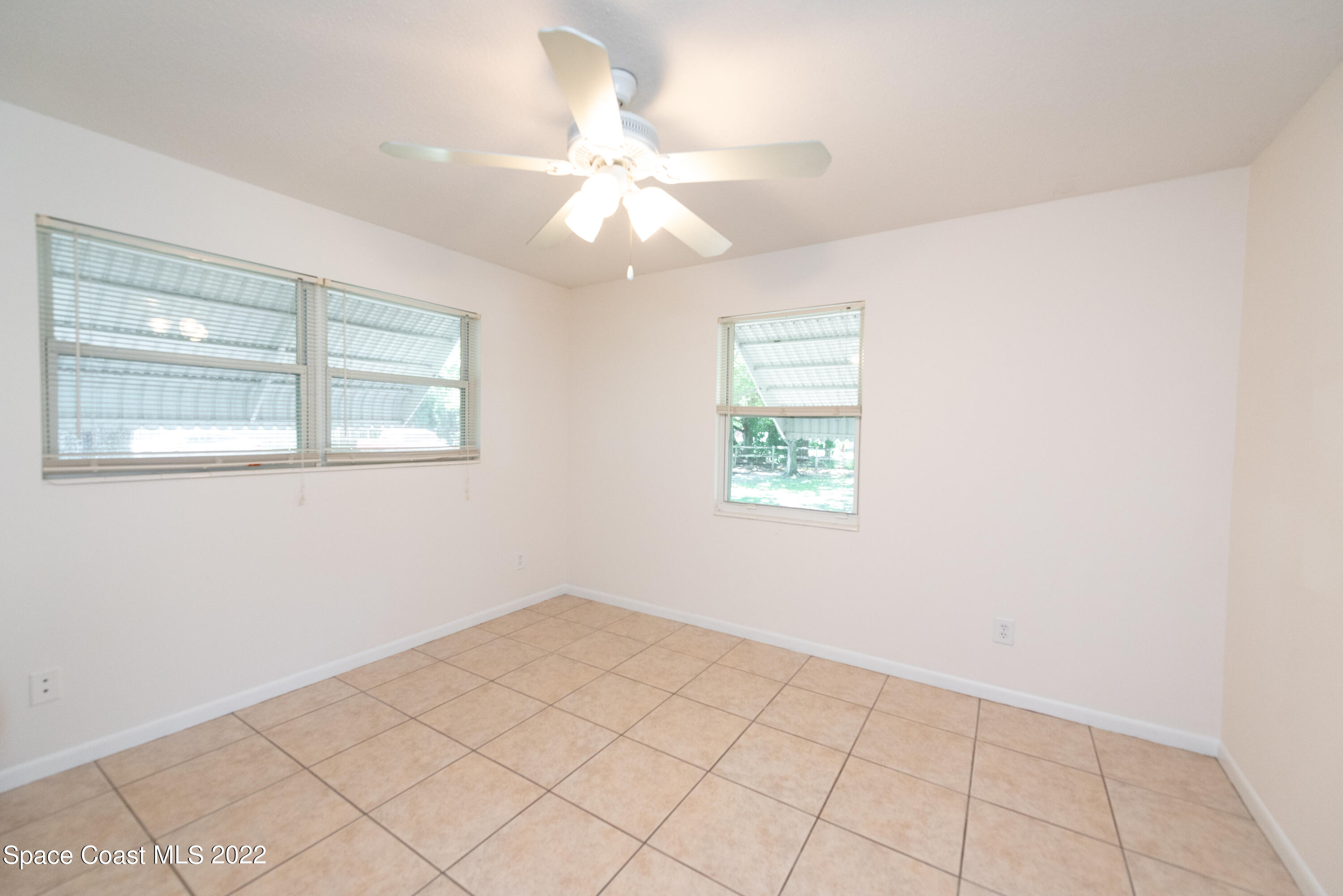 2085 Harlock Road Melbourne, FL 32934 - Photo 10 of 27 a view of an empty room with a window
