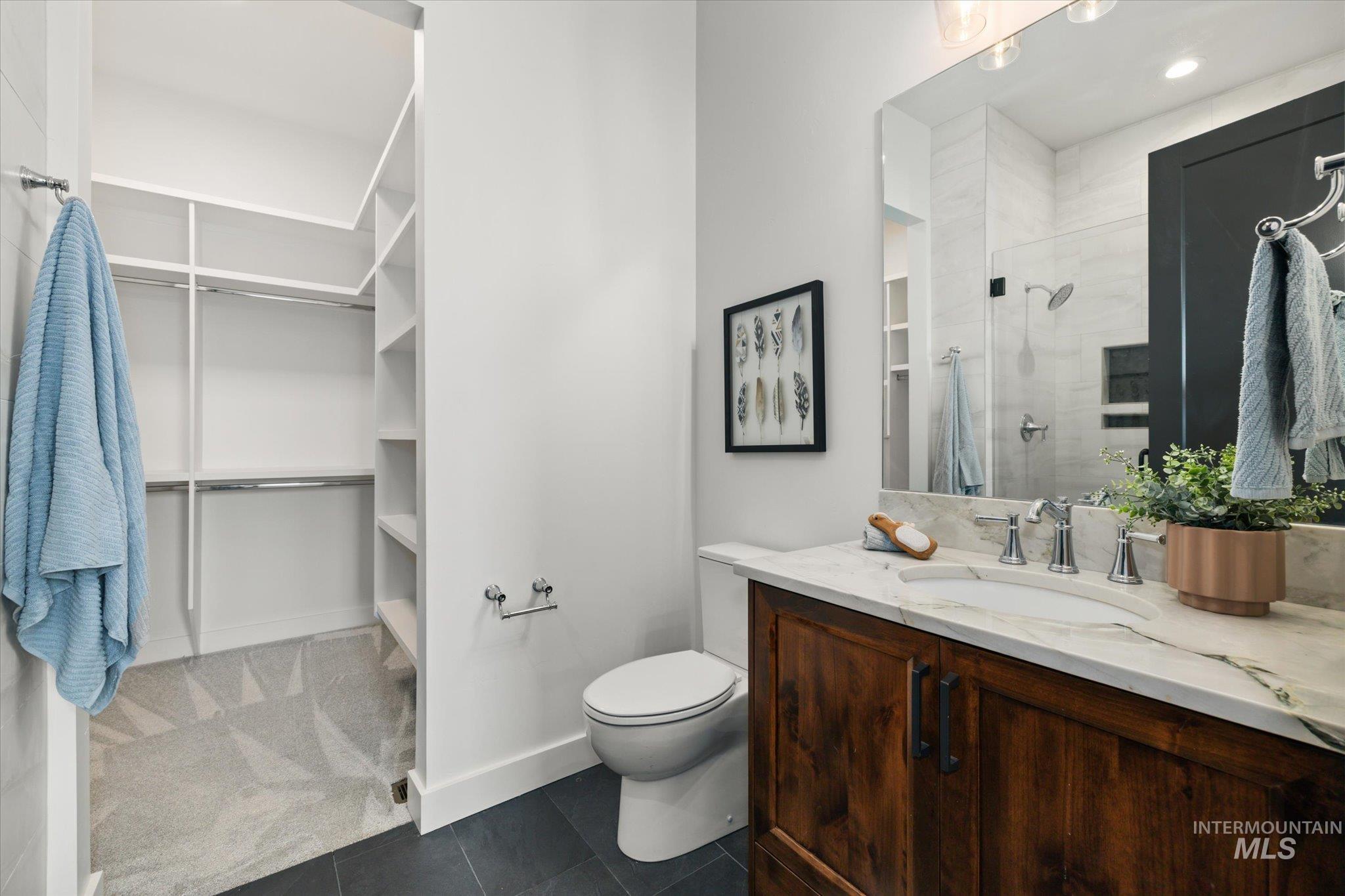 2248 South Trout Stone Way Eagle, ID 83616 - Photo 24 of 50 Full bath featuring vanity, a tile shower, and tile patterned floors