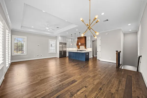 a view of kitchen with cabinets and wooden floor