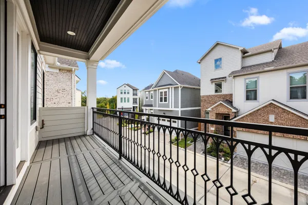 a view of a house with wooden deck