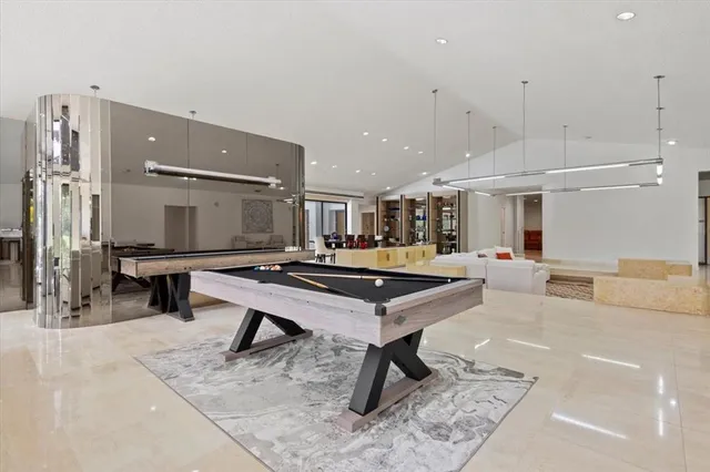 a living room with furniture tv and a large window