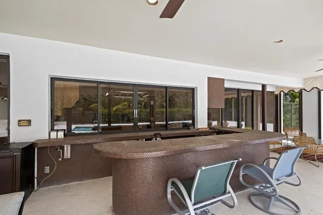 a kitchen with a sink a stove and cabinets