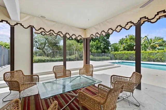 a bedroom with a large bed and a large window