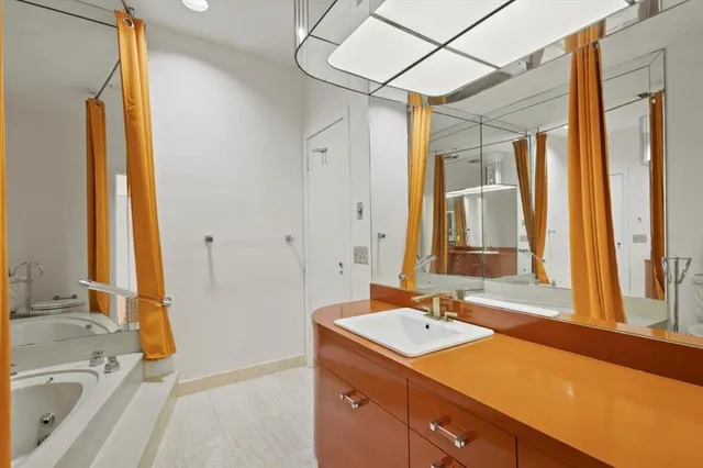 a room with a bed and furniture