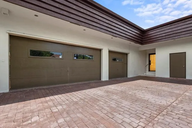 swimming pool view with a seating space and a garden view