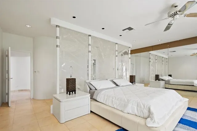 a view of a room with window and a hallway