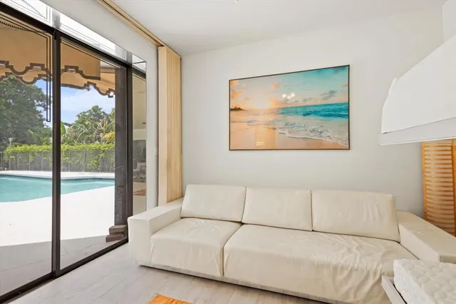 an aerial view of a house with yard green space and mountain view in back