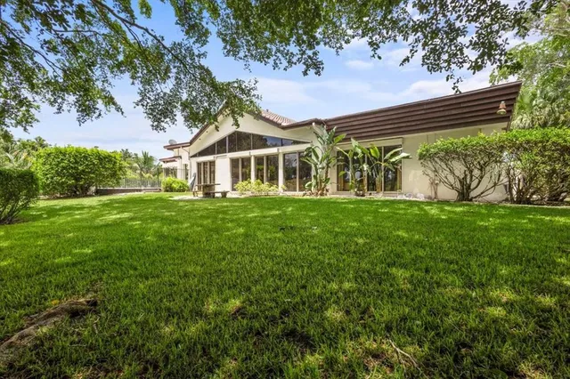 an aerial view of a house with a garden